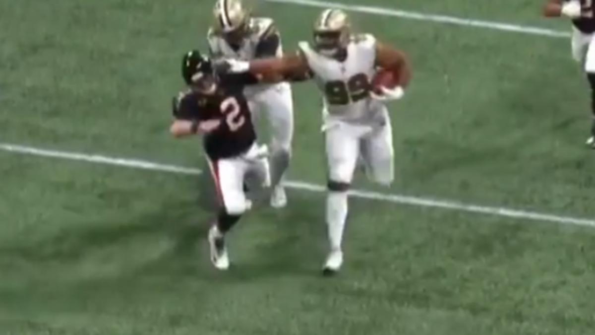 Saints DT Shy Tuttle stiff-arms Falcons QB Matt Ryan after an interception during a 2019 game. Credit: BarDown.com